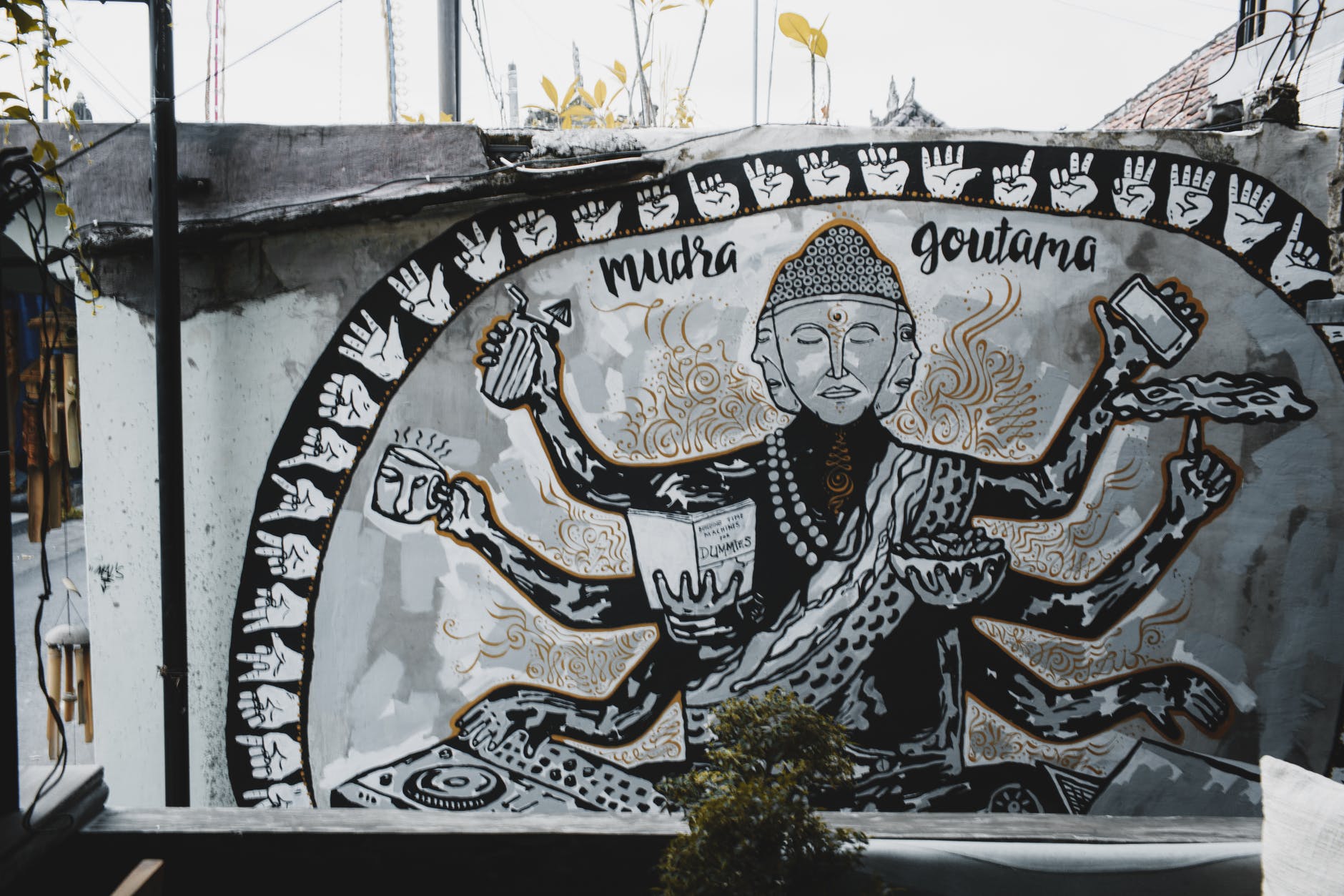 original painting of gautama buddha on wall of shabby house